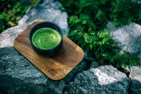 Image of green tea powder in a bowl on a cutting board<br />