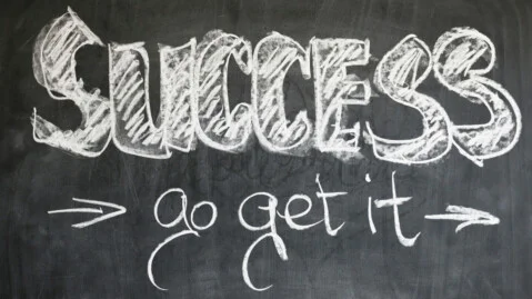 Success begins in the mind — a call to self-actualization written on a chalkboard.<br />